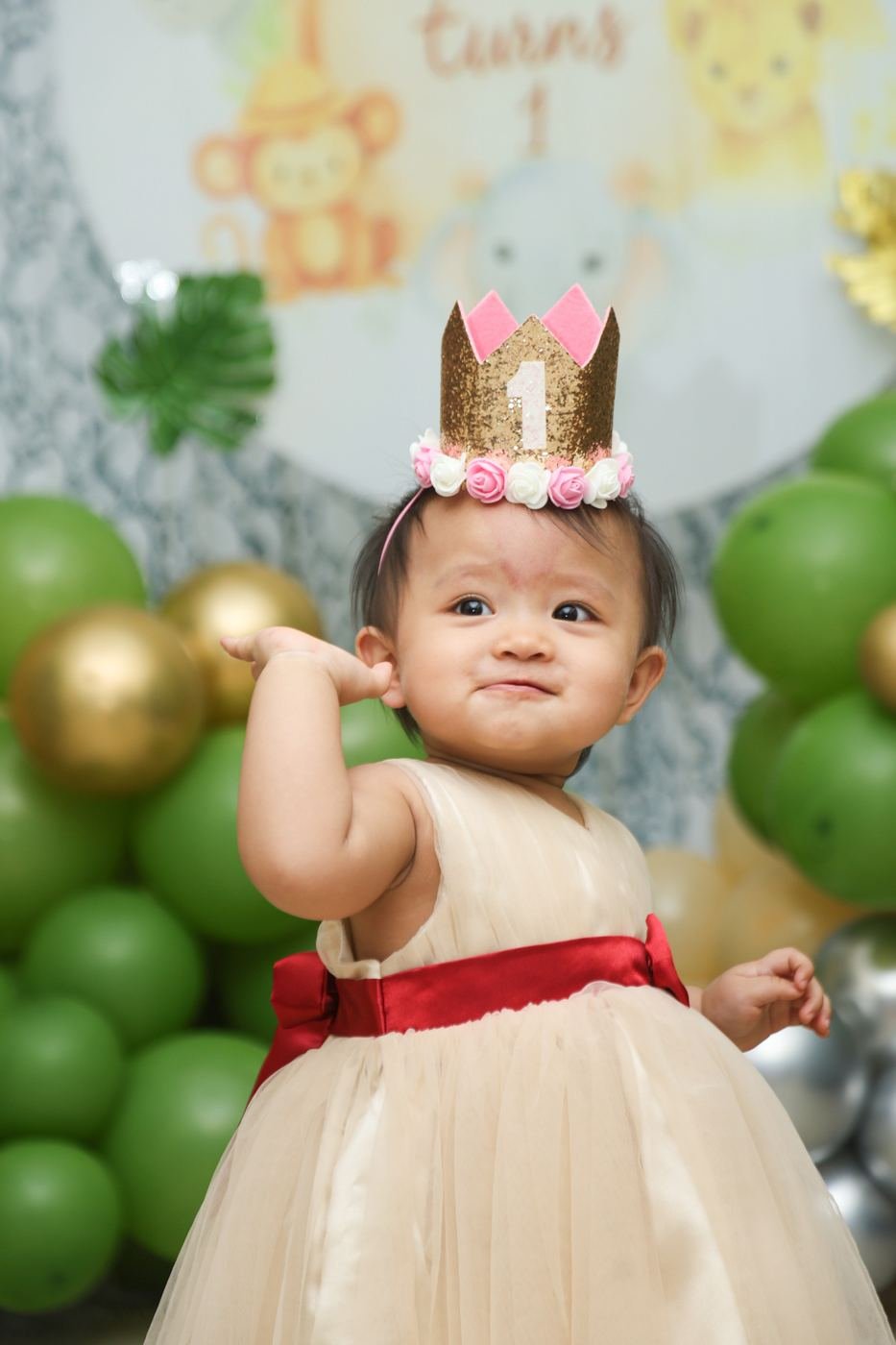 Birthday girl in a crown and party dress