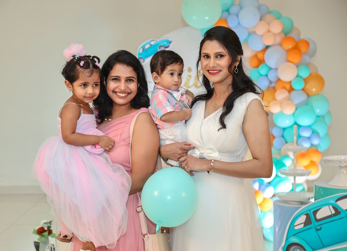 Mother with her two daughters at a birthday party